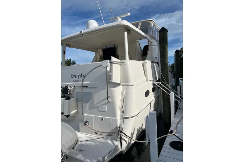Everyday Yacht Photos Pics 2003 Silverton 453 Motor Yacht docked, rear view with clear skies.