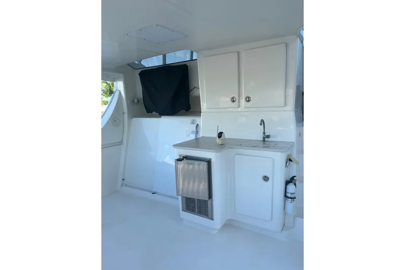 Everyday Yacht Photos Pics 2003 Silverton 453 Motor Yacht interior with kitchenette and storage cabinets.