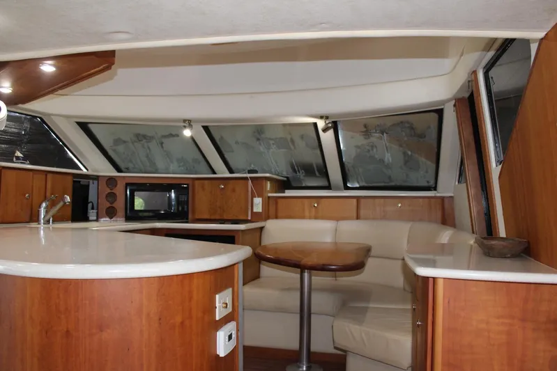 Everyday Yacht Photos Pics Interior of 2003 Silverton 453 Motor Yacht with modern kitchen and seating area.