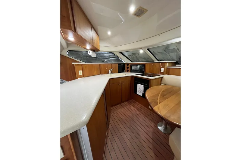 Everyday Yacht Photos Pics Interior of 2003 Silverton 453 Motor Yacht with modern kitchen and dining area.