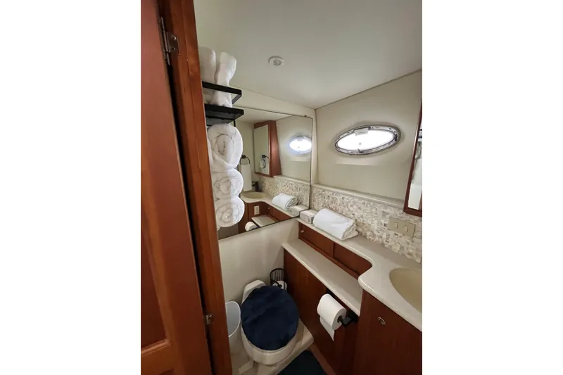 Everyday Yacht Photos Pics Luxurious bathroom in 2003 Silverton 453 Motor Yacht with elegant fixtures and ample storage.