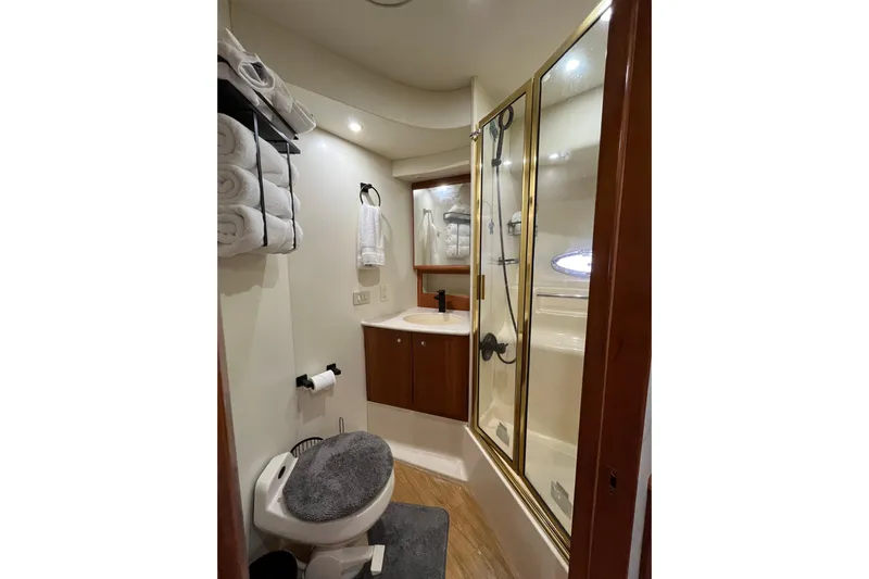 Everyday Yacht Photos Pics Luxurious bathroom in 2003 Silverton 453 Motor Yacht with shower and modern amenities.