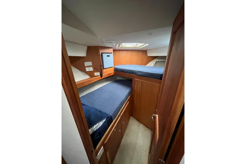 Everyday Yacht Photos Pics 2003 Silverton 453 Motor Yacht cabin with wooden interior and bunk beds.