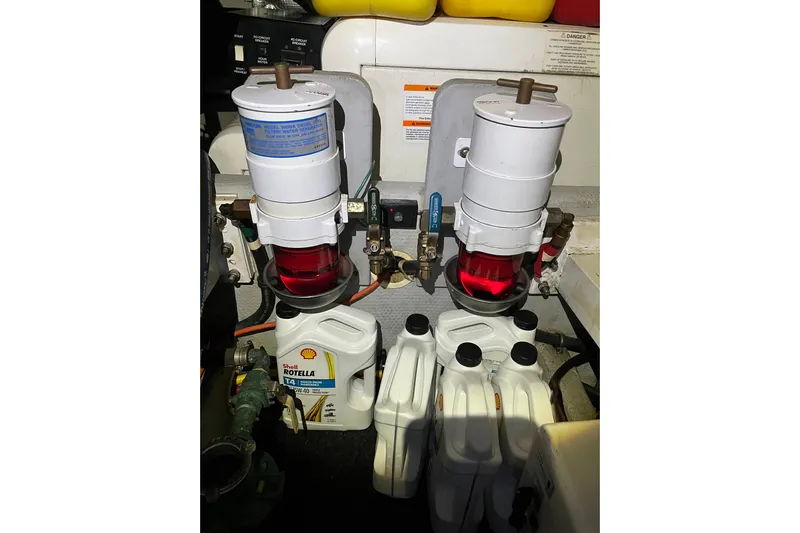 Everyday Yacht Photos Pics Engine room of 2003 Silverton 453 Motor Yacht with fuel filters and oil containers.