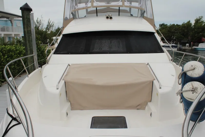 Everyday Yacht Photos Pics 2003 Silverton 453 Motor Yacht docked, featuring covered seating and sleek design.