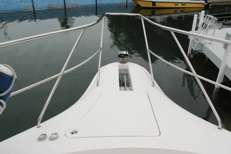 Everyday Yacht Photos Pics Bow view of 2003 Silverton 453 Motor Yacht at dock, featuring stainless steel railings.