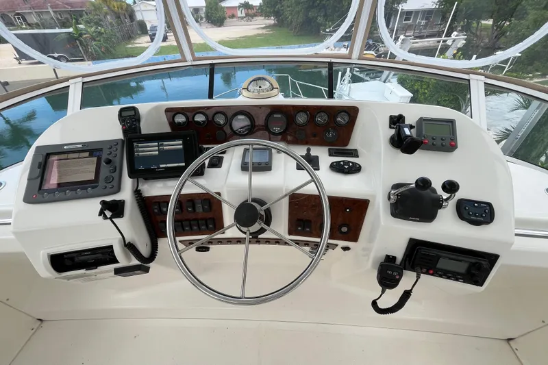 Everyday Yacht Photos Pics Cockpit of 2003 Silverton 453 Motor Yacht with navigation instruments and steering wheel.