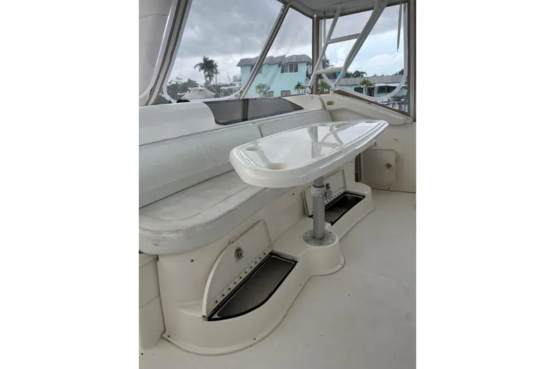 Everyday Yacht Photos Pics 2003 Silverton 453 Motor Yacht interior with seating and table, featuring large windows.