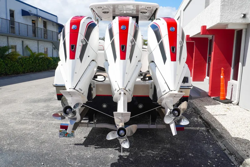  Yacht Photos Pics 2023 Renegade 38 GTS Open with triple outboard engines, rear view.