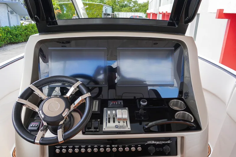  Yacht Photos Pics 2023 Renegade 38 GTS Open dashboard with dual screens and modern controls.
