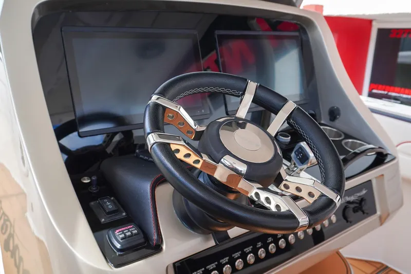  Yacht Photos Pics Steering wheel and dashboard of 2023 Renegade 38 GTS Open boat.
