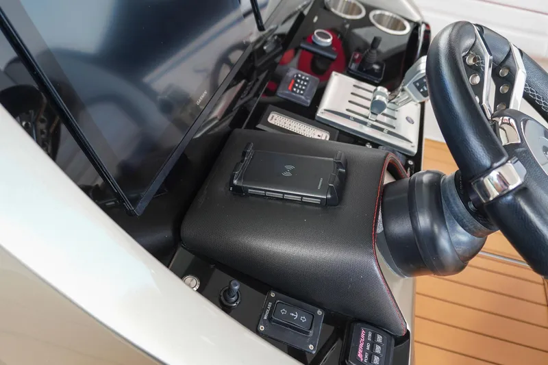  Yacht Photos Pics 2023 Renegade 38 GTS Open dashboard with steering wheel, controls, and display screen.
