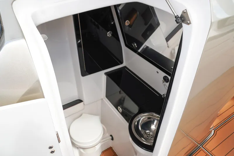  Yacht Photos Pics 2023 Renegade 38 GTS Open boat interior with modern bathroom amenities.