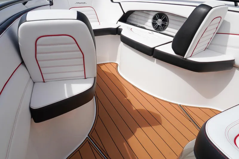  Yacht Photos Pics 2023 Renegade 38 GTS Open boat interior with white and black seating, teak flooring.