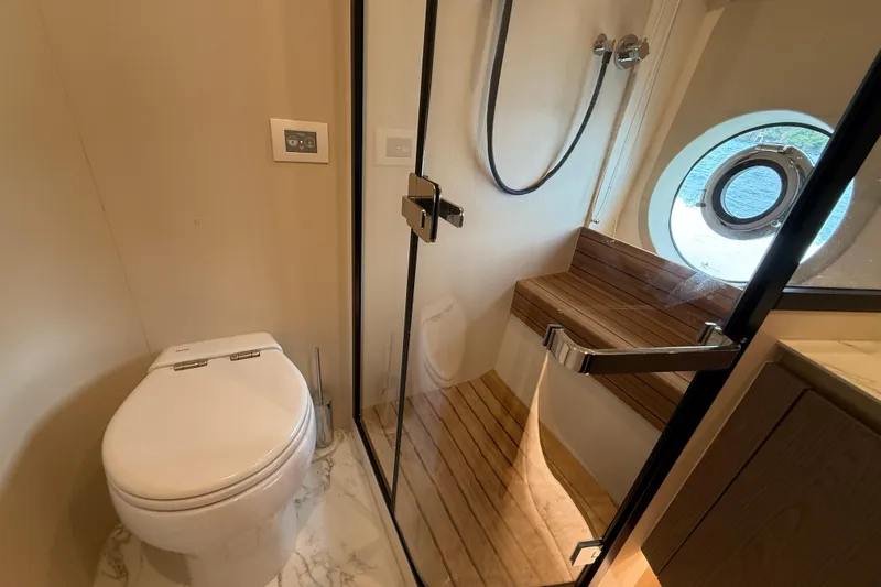  Yacht Photos Pics Luxurious bathroom on 2024 Azimut Magellano 60 yacht with modern shower and toilet.