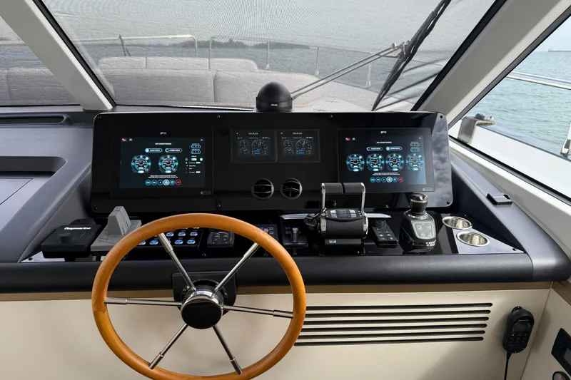  Yacht Photos Pics Helm of 2024 Azimut Magellano 60 yacht with advanced navigation displays.