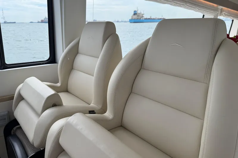  Yacht Photos Pics Luxurious interior seating of 2024 Azimut Magellano 60 yacht with ocean view.