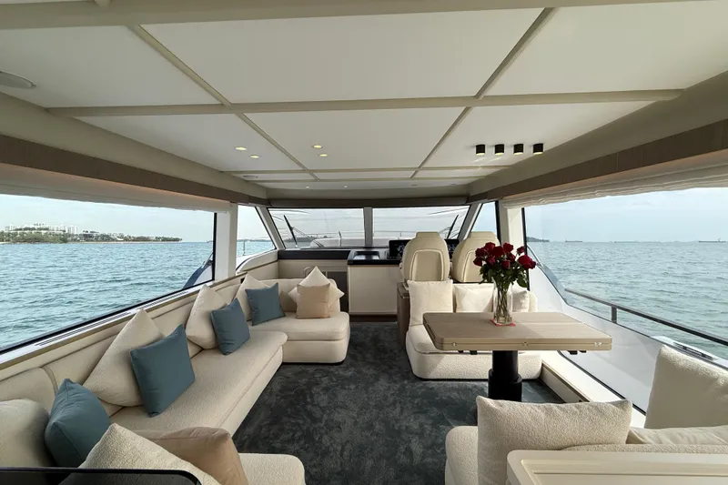  Yacht Photos Pics Luxurious interior of 2024 Azimut Magellano 60 yacht with elegant seating and sea view.