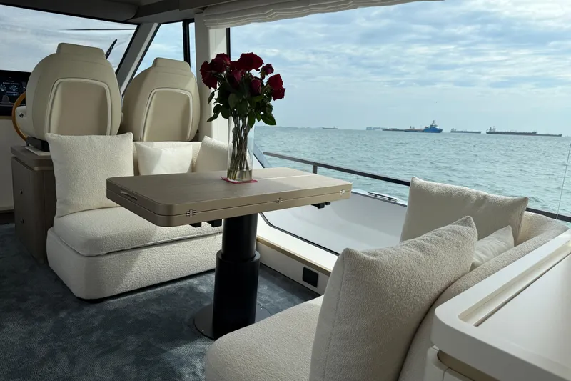  Yacht Photos Pics Luxurious interior of 2024 Azimut Magellano 60 yacht with sea view and elegant seating.