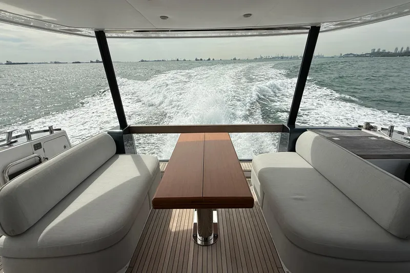  Yacht Photos Pics 2024 Azimut Magellano 60 yacht interior with ocean view and elegant seating.