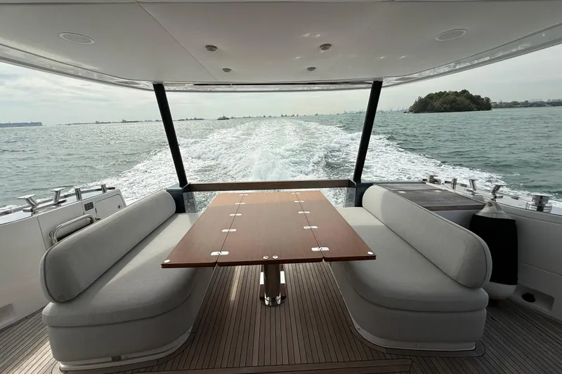  Yacht Photos Pics Luxurious 2024 Azimut Magellano 60 yacht interior with ocean view and elegant seating area.