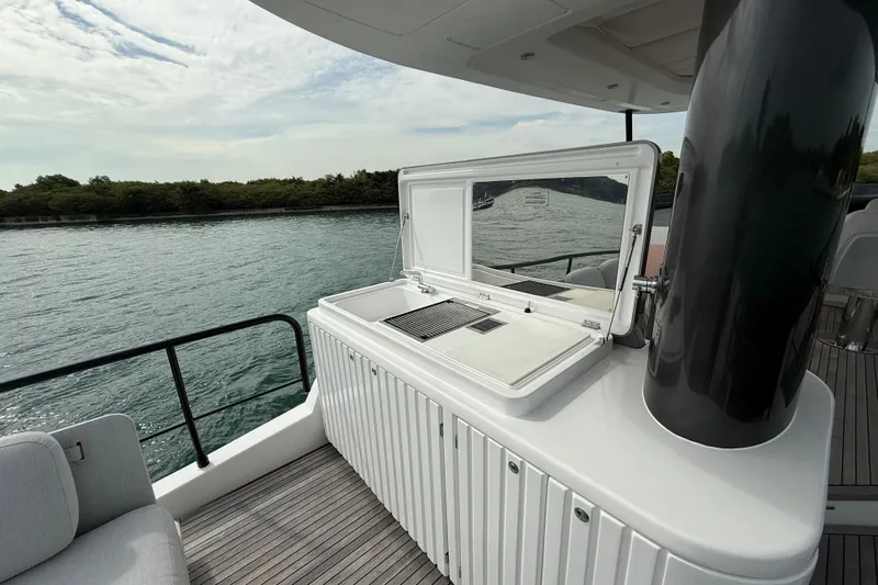  Yacht Photos Pics Outdoor kitchen on 2024 Azimut Magellano 60 yacht, featuring sleek design and waterfront view.
