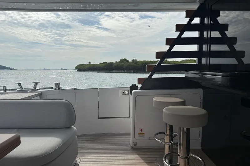  Yacht Photos Pics Luxurious 2024 Azimut Magellano 60 yacht interior with ocean view and modern seating.