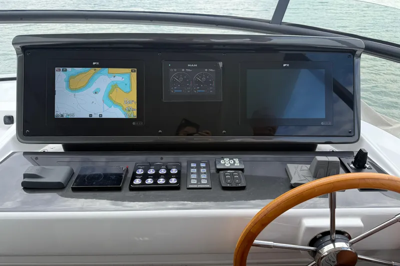  Yacht Photos Pics Helm of 2024 Azimut Magellano 60 yacht with navigation screens and controls.