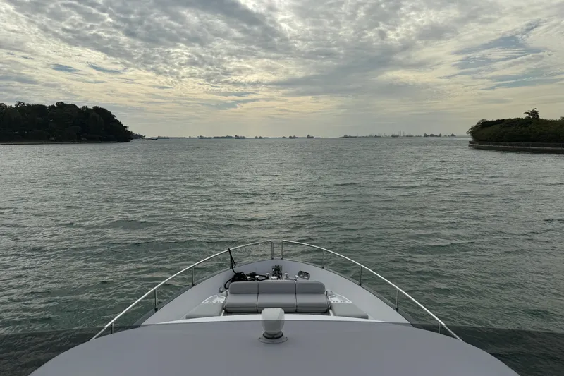  Yacht Photos Pics Bow view of 2024 Azimut Magellano 60 yacht on a serene sea.