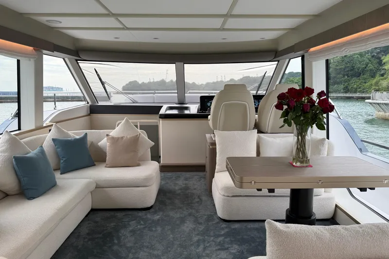  Yacht Photos Pics Luxurious interior of 2024 Azimut Magellano 60 yacht with elegant seating and floral arrangement.