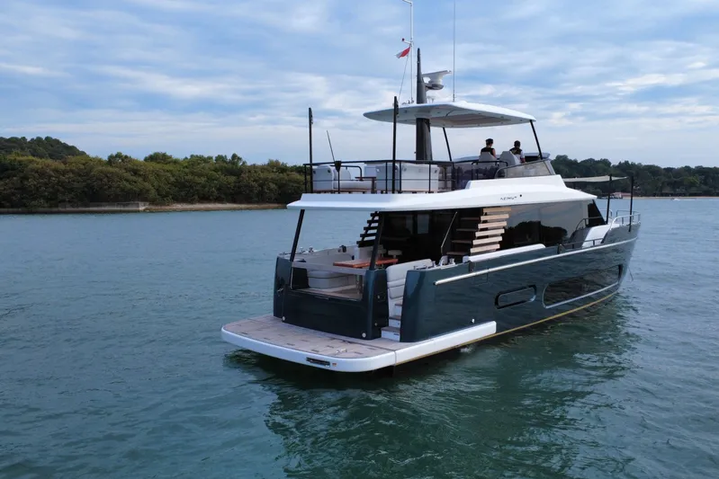  Yacht Photos Pics 2024 Azimut Magellano 60 yacht cruising on serene waters, showcasing luxury and elegance.