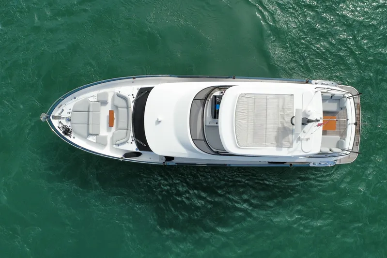  Yacht Photos Pics Aerial view of 2024 Azimut Magellano 60 yacht on turquoise water.