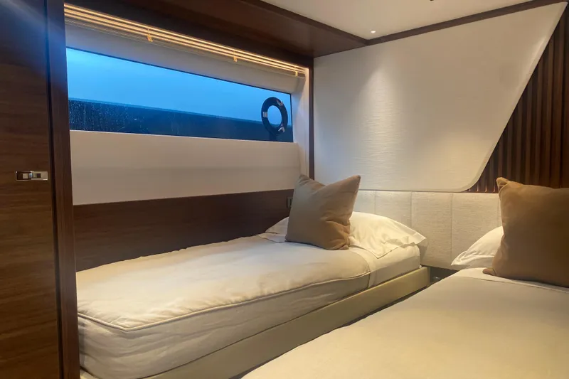  Yacht Photos Pics Luxurious twin cabin interior on 2025 Princess Y72 yacht, featuring modern design and cozy bedding.
