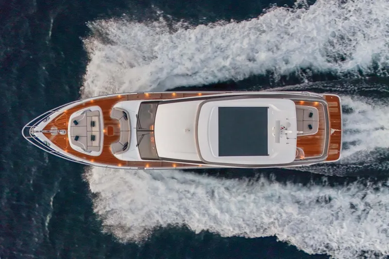  Yacht Photos Pics Aerial view of 2025 Princess Y72 yacht cruising on open water.