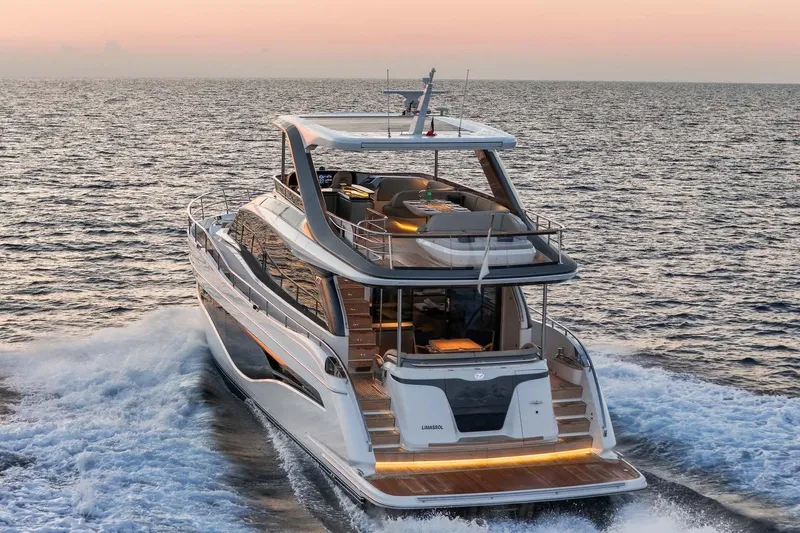  Yacht Photos Pics Luxurious 2025 Princess Y72 yacht cruising at sunset on open sea.
