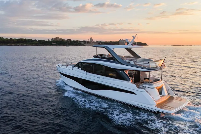  Yacht Photos Pics Luxurious 2025 Princess Y72 yacht cruising at sunset on serene waters.