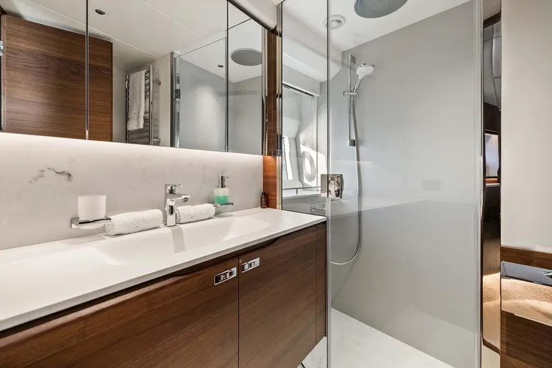  Yacht Photos Pics Luxurious bathroom in 2025 Princess Y72 yacht with modern fixtures and elegant design.
