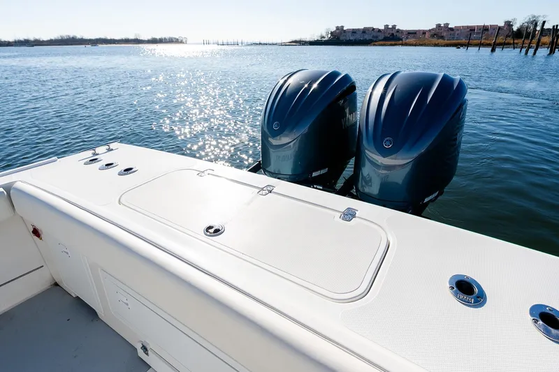  Yacht Photos Pics 2024 Steiger Craft 31 Fisherman boat with dual outboard motors on a sunny day.