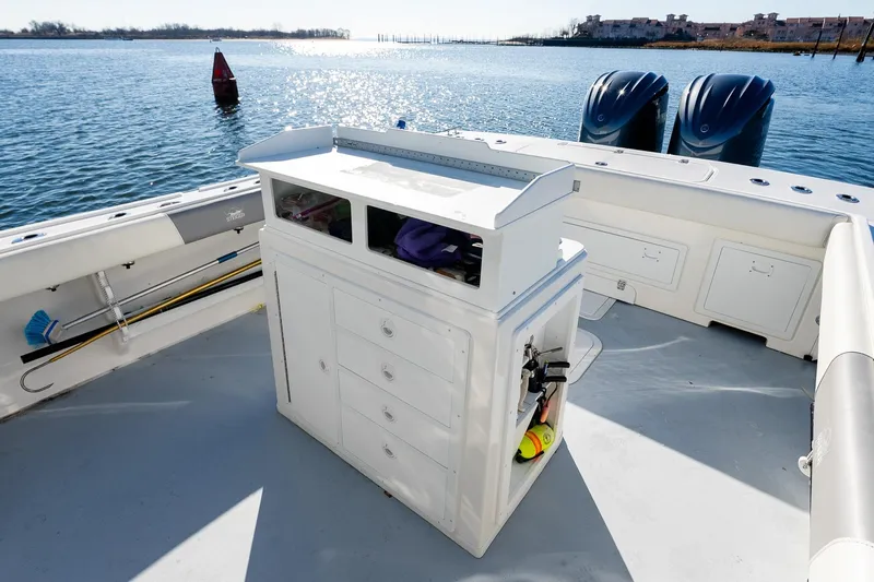  Yacht Photos Pics 2024 Steiger Craft 31 Fisherman boat deck with storage and twin engines on a sunny day.