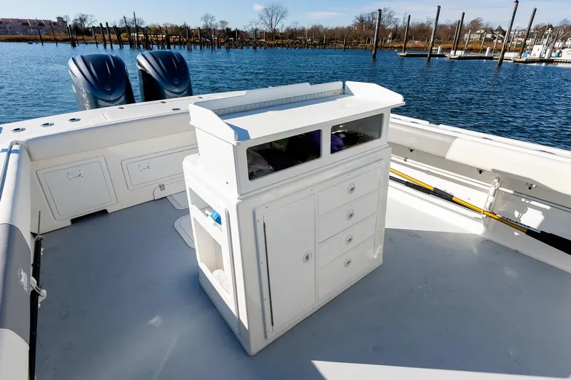  Yacht Photos Pics 2024 Steiger Craft 31 Fisherman boat interior with storage and dual engines on a calm water backdrop.