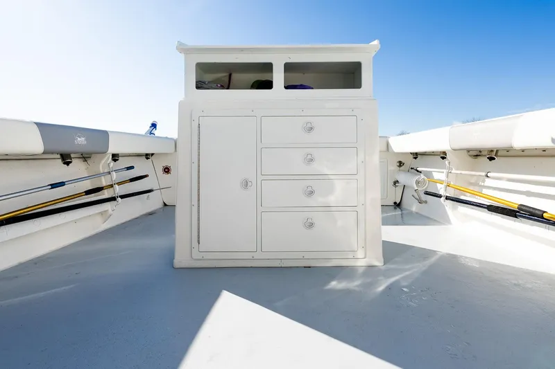 Yacht Photos Pics 2024 Steiger Craft 31 Fisherman boat interior with storage compartments and fishing rod holders.