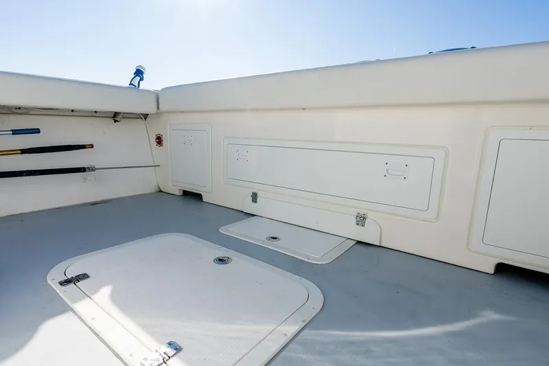  Yacht Photos Pics 2024 Steiger Craft 31 Fisherman boat interior with storage compartments and fishing rod holders.