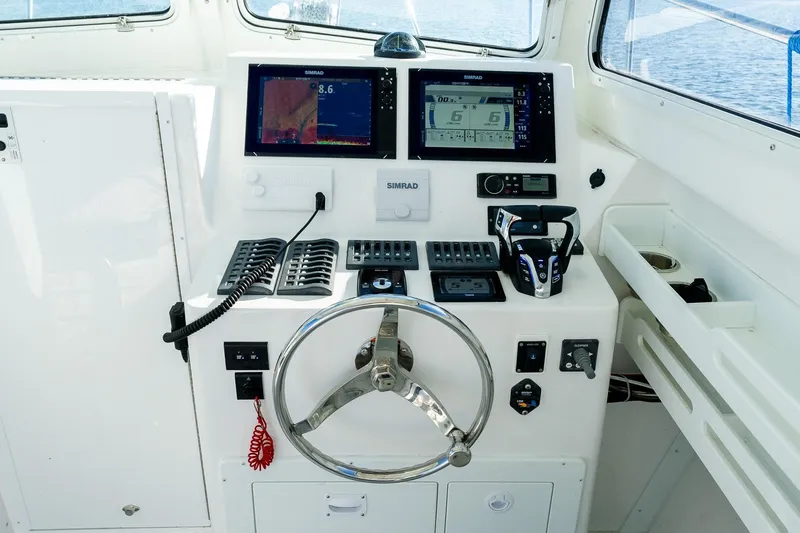 Yacht Photos Pics 2024 Steiger Craft 31 Fisherman helm with modern navigation and control systems.