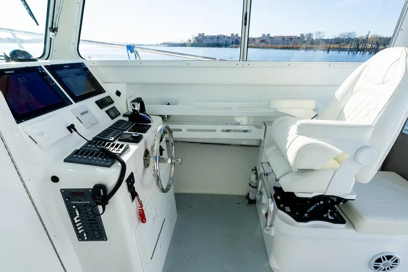  Yacht Photos Pics 2024 Steiger Craft 31 Fisherman helm with modern controls and comfortable captain's chair.