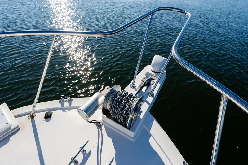  Yacht Photos Pics Bow of 2024 Steiger Craft 31 Fisherman with anchor chain, glistening water.
