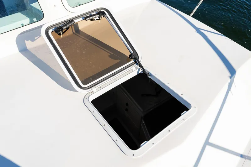  Yacht Photos Pics Open hatch on 2024 Steiger Craft 31 Fisherman boat deck, overlooking water.