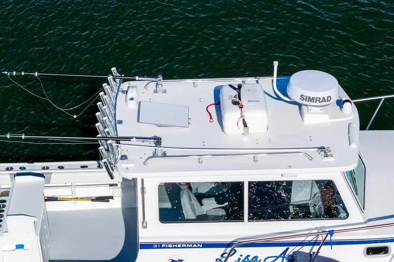  Yacht Photos Pics 2024 Steiger Craft 31 Fisherman boat with fishing rods and Simrad equipment on deck.