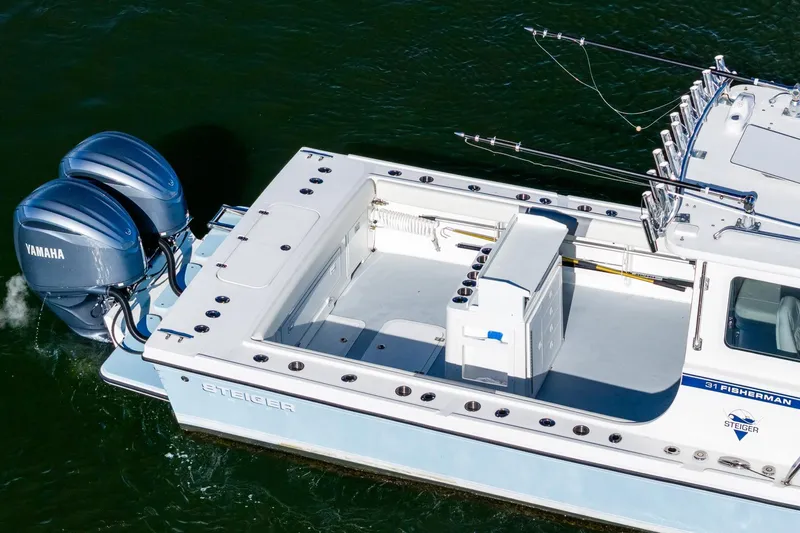  Yacht Photos Pics 2024 Steiger Craft 31 Fisherman boat with dual Yamaha engines on water.