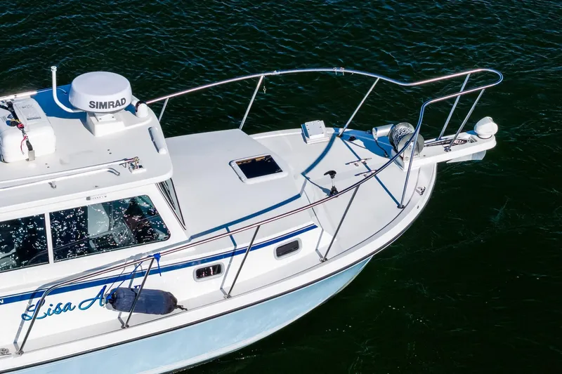  Yacht Photos Pics 2024 Steiger Craft 31 Fisherman boat on water, featuring Simrad equipment.