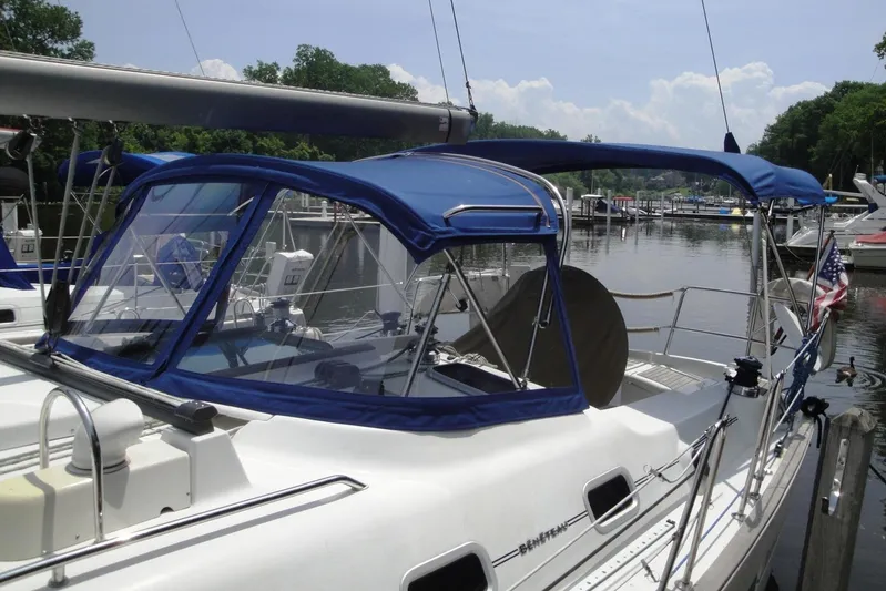  Yacht Photos Pics 2006 Beneteau Oceanis Clipper 423 sailboat docked with blue canopy.